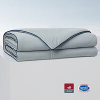A folded gray comforter against a white background, showcasing its soft texture and color. #Color_Cool Grey