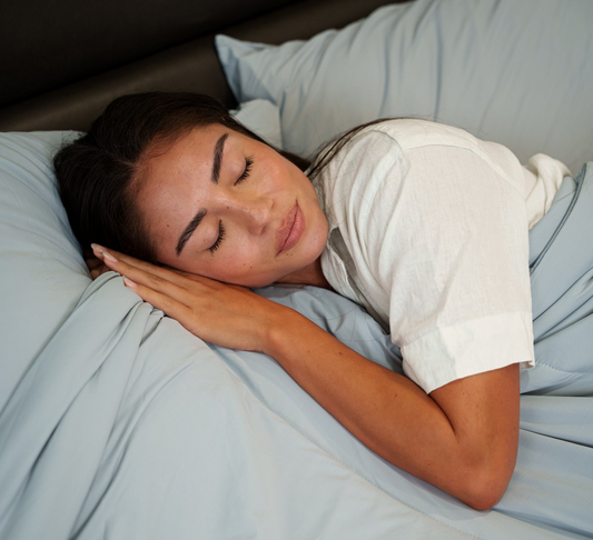 woman sleeping comfortably in dream valley bedding